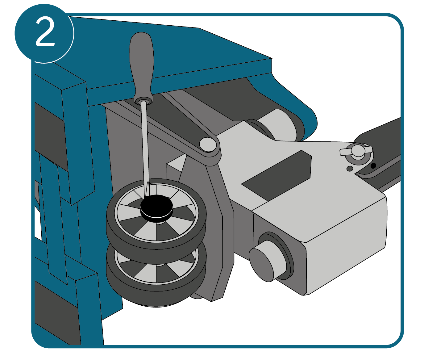 A pallet truck positioned on its side with a flathead screwdriver removing the wheel cap